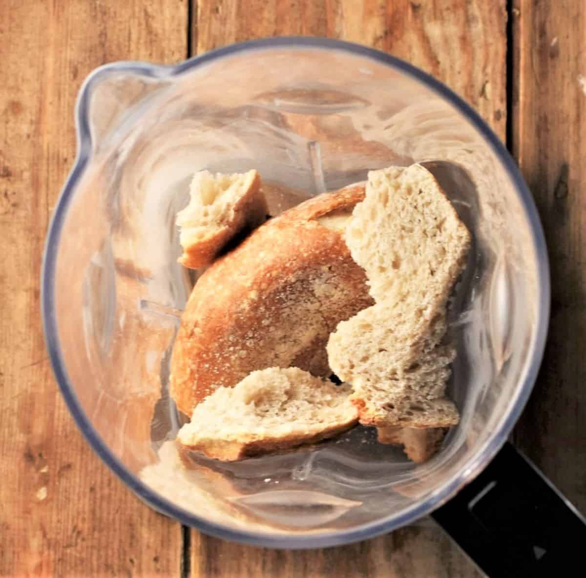 Top down view of pieces of bread in blender.