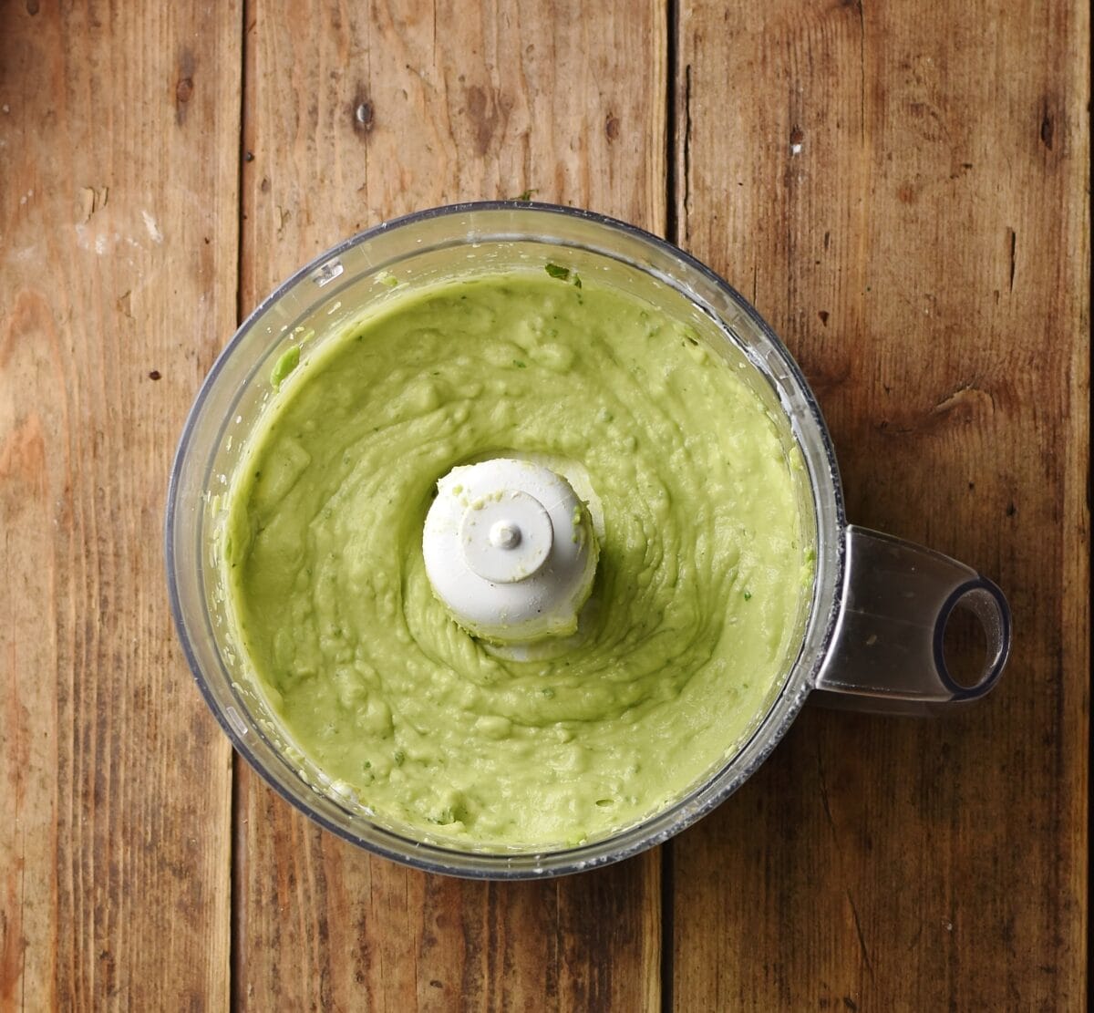 Creamy avocado mixture in blender.