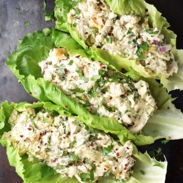Top down view of chicken cottage cheese salad in lettuce leaves.