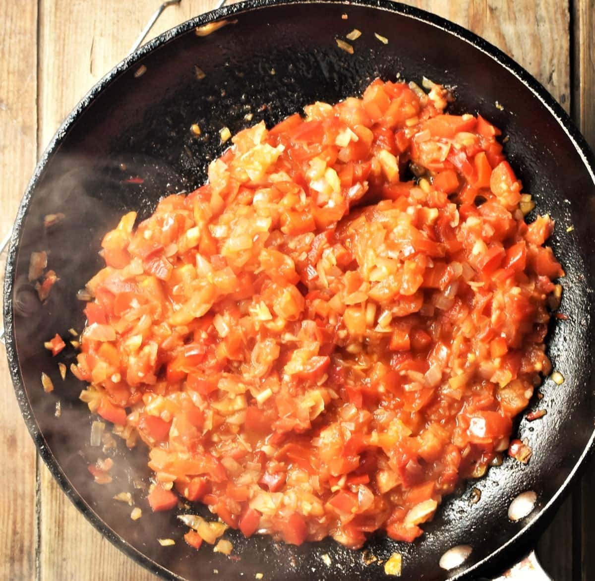 Tomato red pepper sauce in large pan.