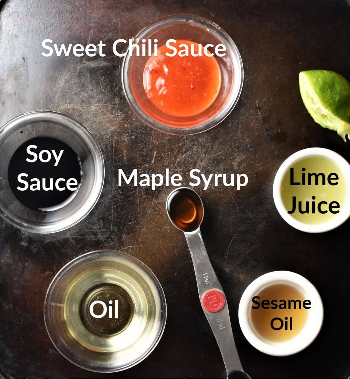 Pomelo salad dressing ingredients in individual dishes.