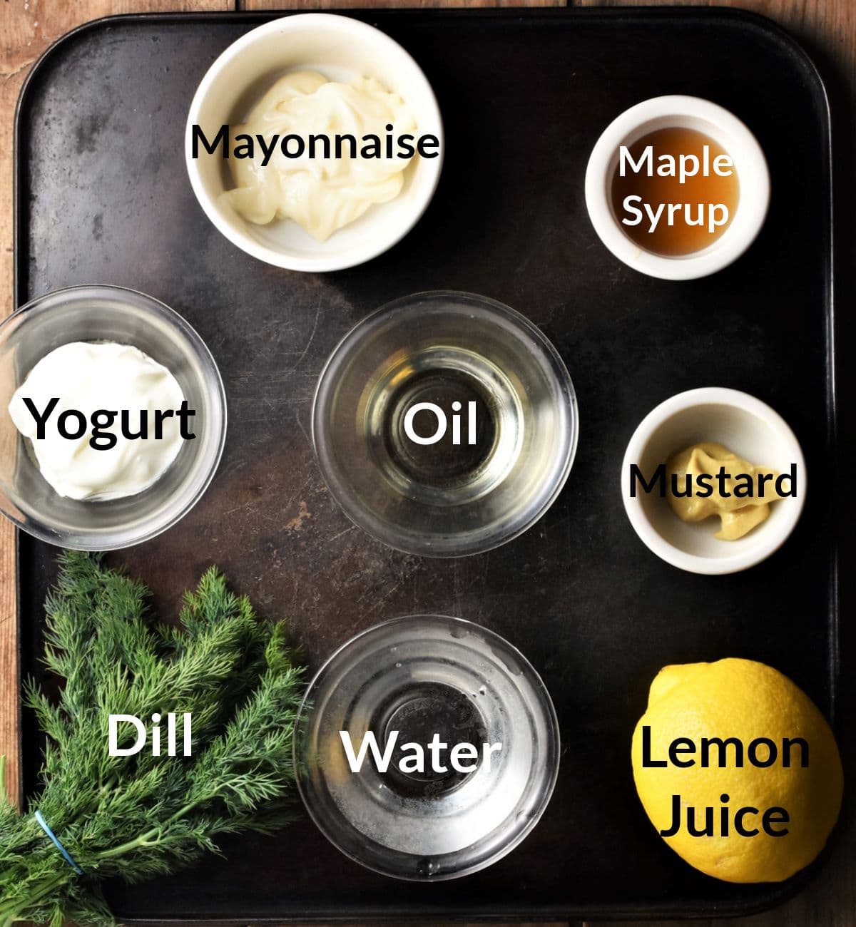 Ingredients for making dill salad dressing for potato and salmon salad.