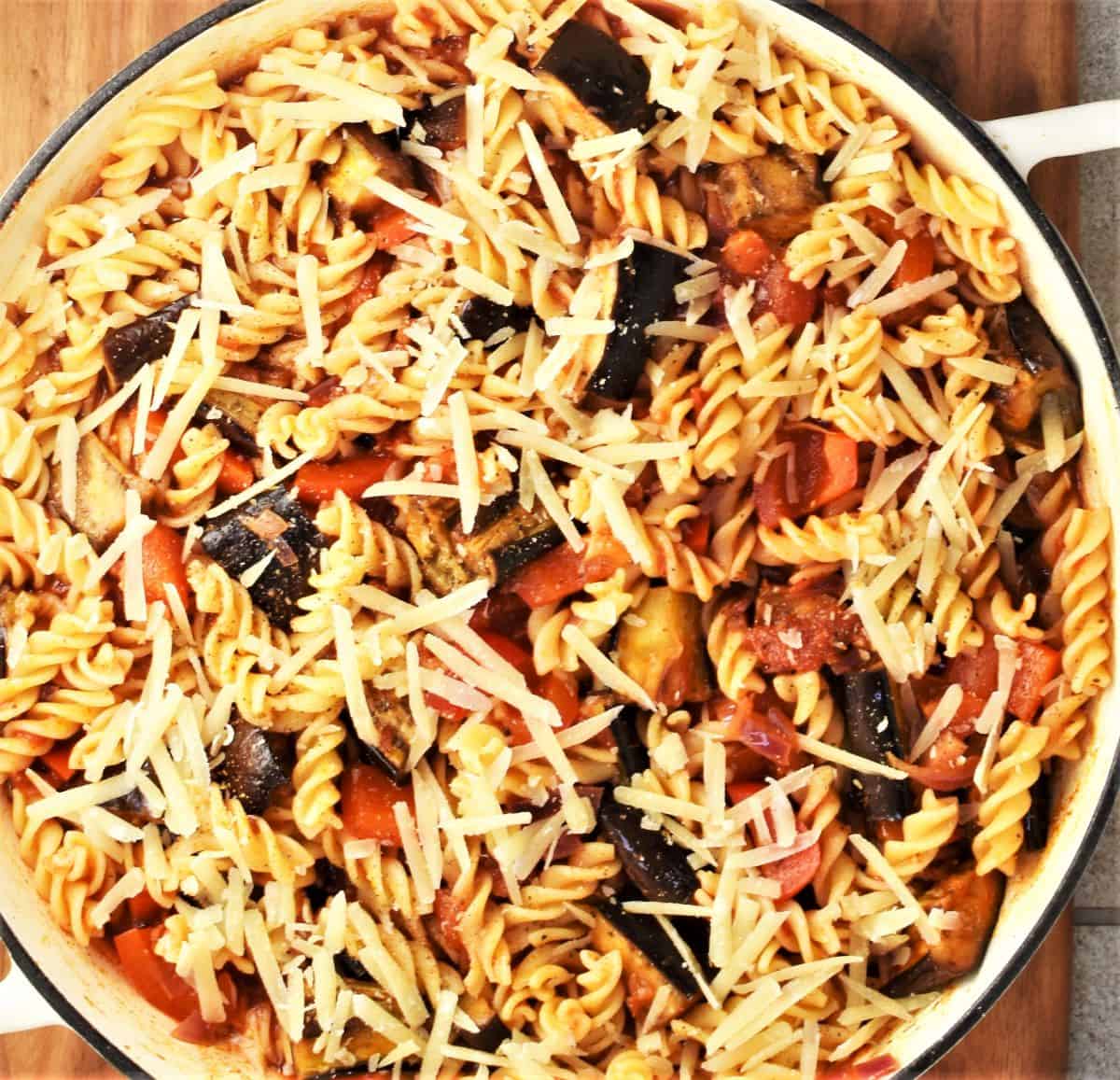 Top down view of pasta and eggplant casserole in round dish.
