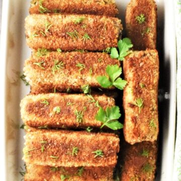 Top down view of mushroom croquettes in ceramic dish.