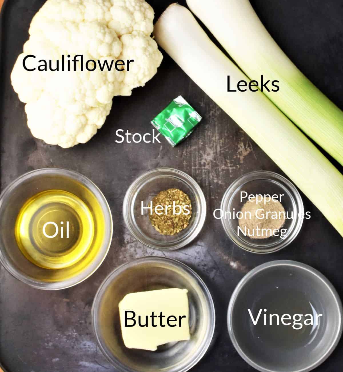 Ingredients for making leek and cauliflower soup in individual dishes.