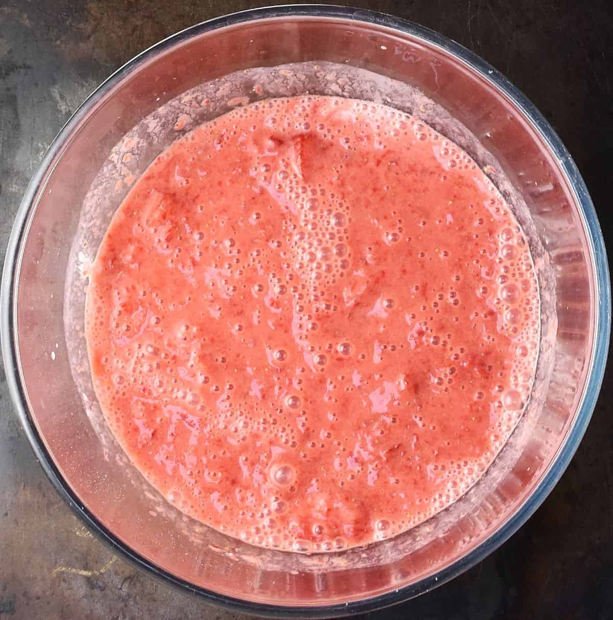 Creamy strawberry sauce in glass bowl.